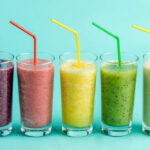 Airport Invasion: Smoothie Chain Makes Bold Play Four colorful beverage cans on a pink background
