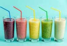 Airport Invasion: Smoothie Chain Makes Bold Play Four colorful beverage cans on a pink background