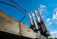 Surface-to-air missiles mounted on a military launcher under a blue sky