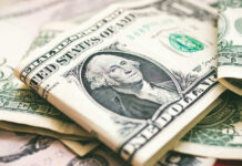 AI Gold Rush Mints THESE Millionaires U.S. dollar bills with George Washington visible.