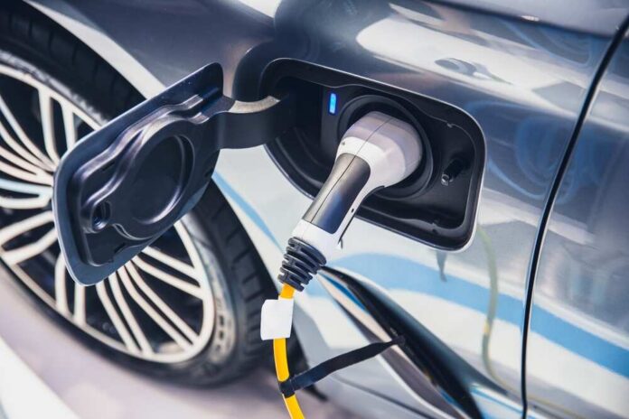 Electric car charging port with plug connected