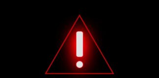 Red warning triangle with exclamation mark on black background
