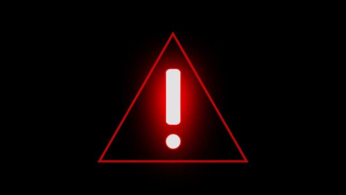 Red warning triangle with exclamation mark on black background
