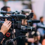 OPEC’s Illusion? Prices Drop, Taps Open Video cameras on tripods at a media event