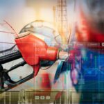 Four-Dollar Gas Returns — What’s Really Driving It? Gas pump with financial data overlay and oil refinery in the background
