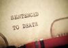 BOMBSHELL : TV Star Condemned To Death Close-up of a typewritten document stating 'SENTENCED TO DEATH'