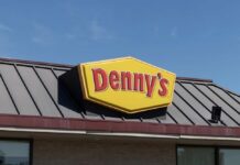 Denny’s Announces What’s Coming and Where Dennys sign illuminated against a twilight sky