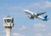 Mystery Cut Cripples Skies Over U.S. An airplane taking off near an airport control tower