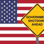 American flag government shutdown warning sign
