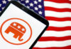 Republican elephant logo on phone, American flag background.