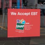 SNAP Shock: 80 Hours Or Else Sign indicating EBT acceptance for food purchases