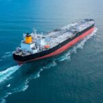 Hormuz Turns Hot: Blockade War Erupts An oil tanker navigating through calm ocean waters