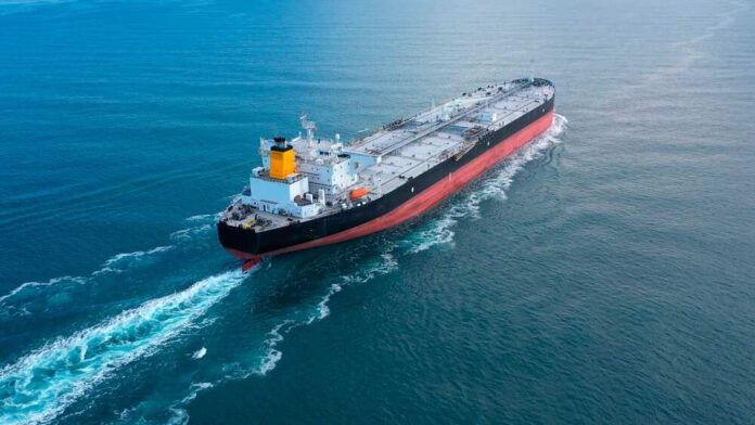 An oil tanker navigating through calm ocean waters
