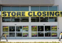25 Stores Gone — Now What? Storefront with a large 'STORE CLOSING!' banner and sale signs