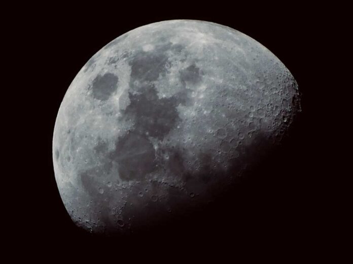 A,Beautiful,Closeup,Shot,Of,The,Moon,With,A,Black Close-up view of the moon showing craters and surface details