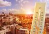 Planetary Heatline Crossed — Now What? Thermometer showing high temperature over a sunlit cityscape