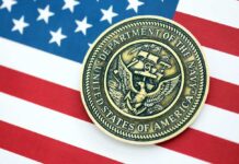 Overboard Alarm Sparks Navy U-Turn Navy medal placed on an American flag background