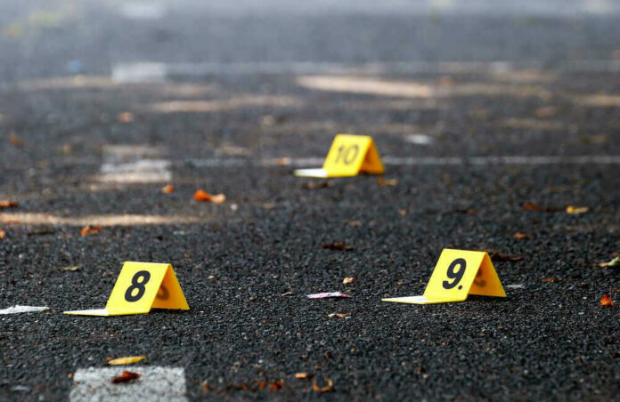 Yellow evidence markers labeled 8, 9, 10 on pavement.