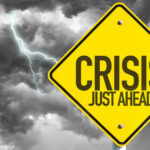 Bus Chaos Looms — Pay Skyrockets Yellow sign reading Crisis Just Ahead with stormy sky