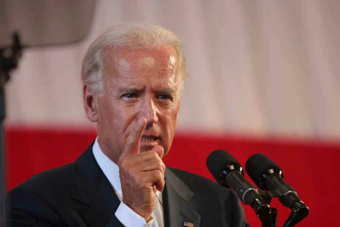 85335553 Joe Biden speaking at a podium, pointing his finger during a speech