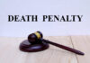 Killer Begs Death A wooden gavel resting on a block with the words 'DEATH PENALTY' in bold above it