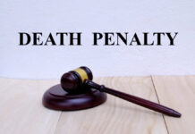 Killer Begs Death A wooden gavel resting on a block with the words 'DEATH PENALTY' in bold above it