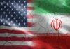 Iran Spy Plot Targets US Flags of the United States and Iran blended together with a cracked texture