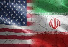 Iran Spy Plot Targets US Flags of the United States and Iran blended together with a cracked texture