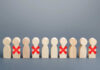 Giant Axes Workers Wooden human figures in a row with red X marks on some