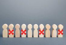 Giant Axes Workers Wooden human figures in a row with red X marks on some