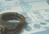 Cop Print Nails Child Killer Handcuffs on a fingerprint document.