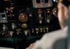 Aircraft cockpit overhead panel with illuminated switches and gauges