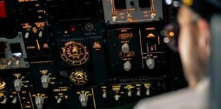 Aircraft cockpit overhead panel with illuminated switches and gauges