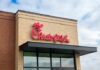 Chick-fil-A restaurant sign on a brick building