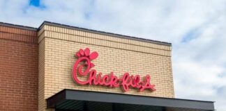 Chick-fil-A restaurant sign on a brick building