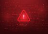 Warning triangle icon on red digital background